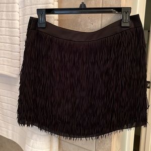 Express fringe, feathered skirt, satin waistband